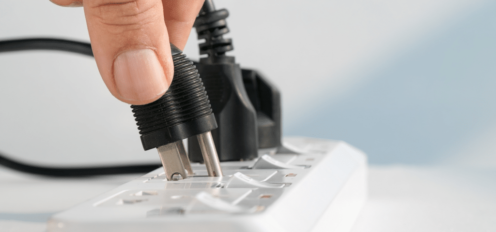 cord getting plugged into a power strip