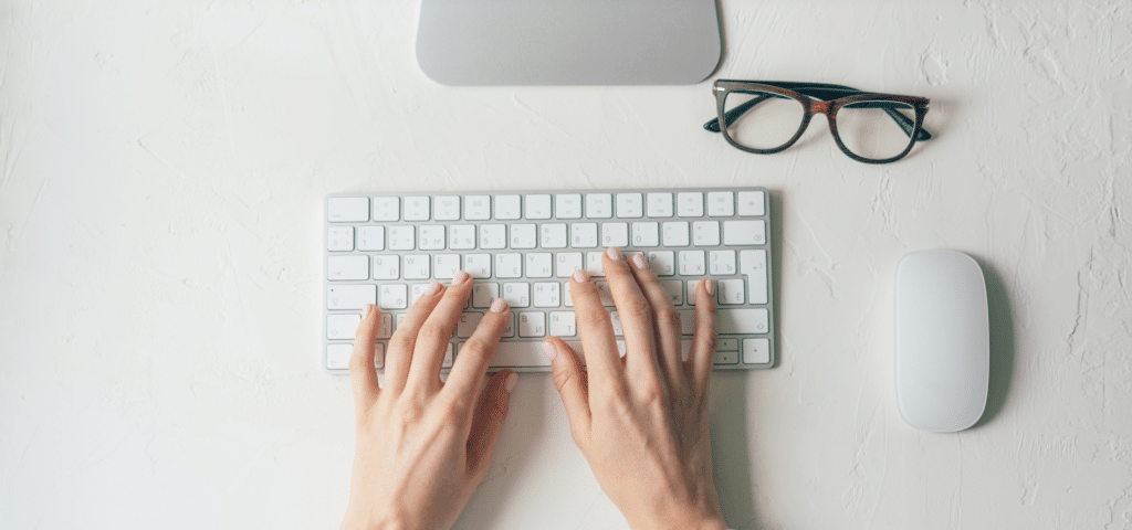 woman typing on computer